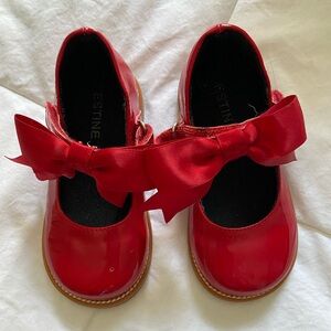 Red patent shoes with bows